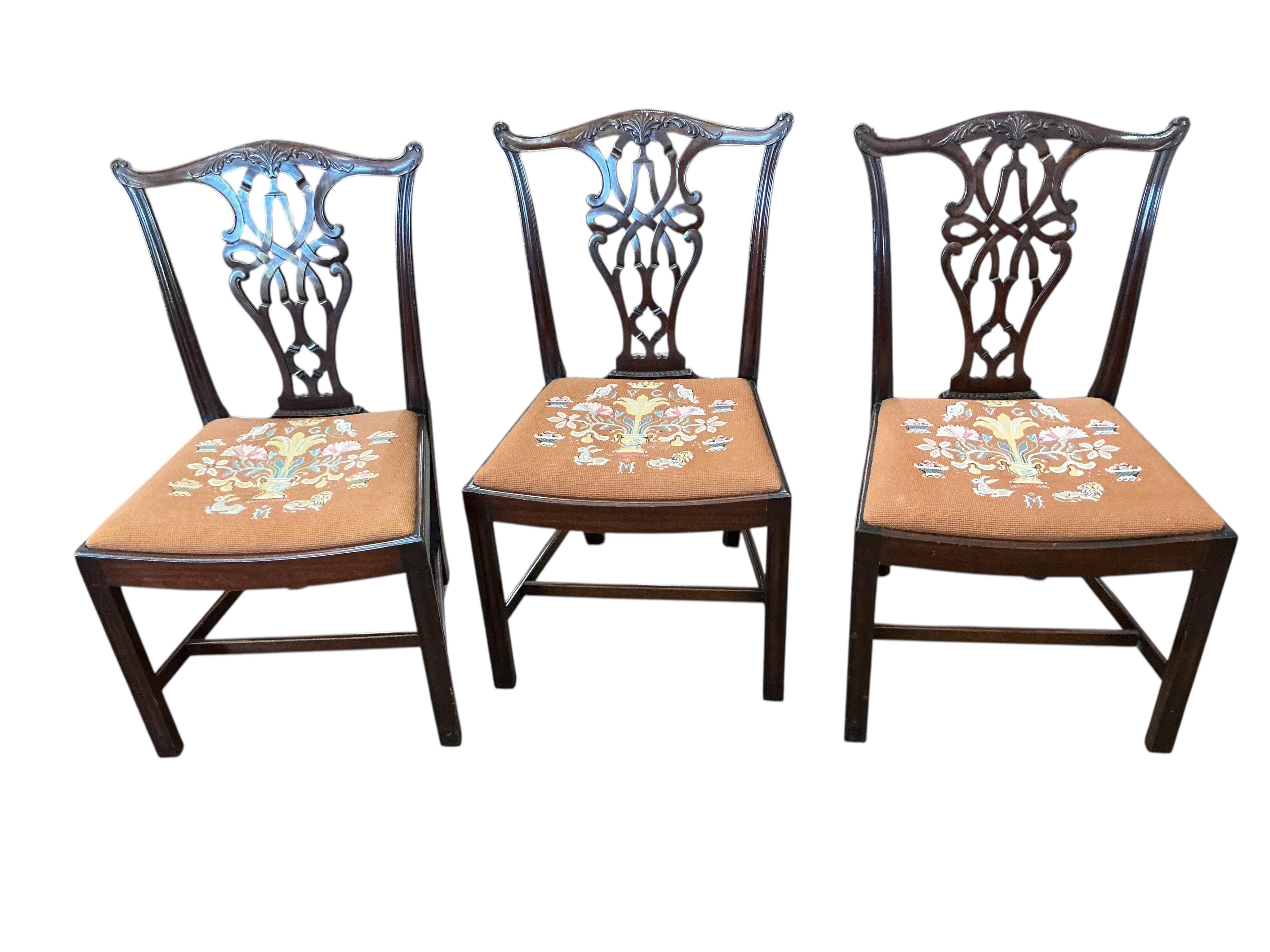 A Victorian style mahogany extending dining table, width 226cm extended, two spare leaves together with a set of eight Chippendale Revival mahogany dining chairs, two with arms